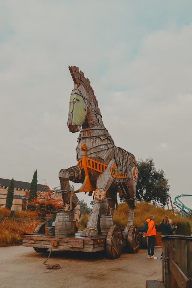 A wooden trojan horse on a wheeled platform.