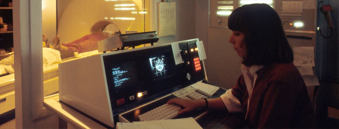 A radiologist supervising a patient scan.